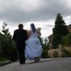 groom and bride walking away after wedding by The Radiant Touch