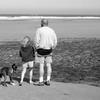grandpa, grand daughter and dog on beach
